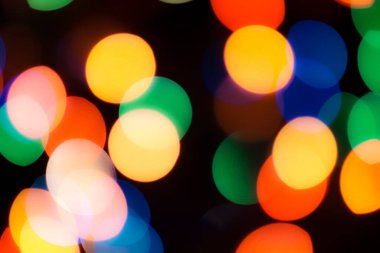 Soyut renkli, odaklanmış dairesel fakül. Bokeh bulanık renk ışığı arka planı kullanabilir. Yeni yıl Bokeh feshi