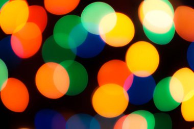 Soyut renkli, odaklanmış dairesel fakül. Bokeh bulanık renk ışığı arka planı kullanabilir. Yeni yıl Bokeh feshi