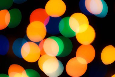 Soyut renkli, odaklanmış dairesel fakül. Bokeh bulanık renk ışığı arka planı kullanabilir. Yeni yıl Bokeh feshi