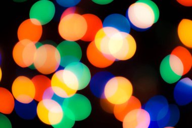 Soyut renkli, odaklanmış dairesel fakül. Bokeh bulanık renk ışığı arka planı kullanabilir. Yeni yıl Bokeh feshi