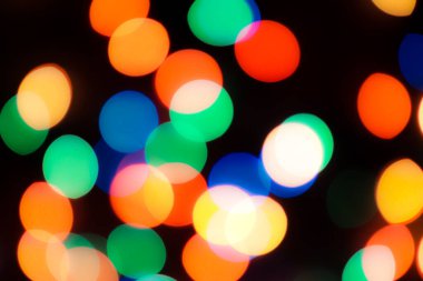 Soyut renkli, odaklanmış dairesel fakül. Bokeh bulanık renk ışığı arka planı kullanabilir. Yeni yıl Bokeh feshi