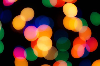 Soyut renkli, odaklanmış dairesel fakül. Bokeh bulanık renk ışığı arka planı kullanabilir. Yeni yıl Bokeh feshi