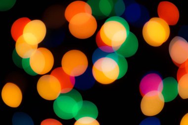 Soyut renkli, odaklanmış dairesel fakül. Bokeh bulanık renk ışığı arka planı kullanabilir. Yeni yıl Bokeh feshi