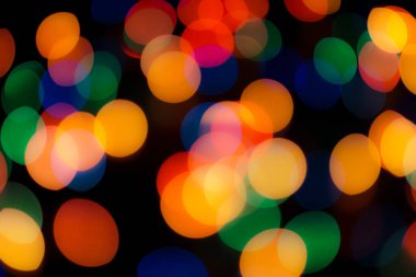 Soyut renkli, odaklanmış dairesel fakül. Bokeh bulanık renk ışığı arka planı kullanabilir. Yeni yıl Bokeh feshi