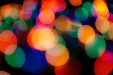 Soyut renkli, odaklanmış dairesel fakül. Bokeh bulanık renk ışığı arka planı kullanabilir. Yeni yıl Bokeh feshi