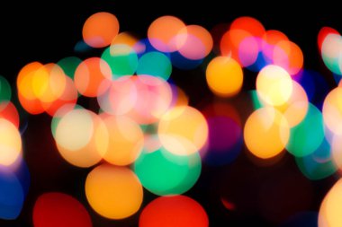 Soyut renkli, odaklanmış dairesel fakül. Bokeh bulanık renk ışığı arka planı kullanabilir. Yeni yıl Bokeh feshi