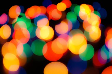 Soyut renkli, odaklanmış dairesel fakül. Bokeh bulanık renk ışığı arka planı kullanabilir. Yeni yıl Bokeh feshi