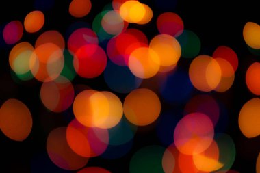 Soyut renkli, odaklanmış dairesel fakül. Bokeh bulanık renk ışığı arka planı kullanabilir. Yeni yıl Bokeh feshi