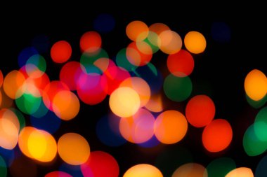 Soyut renkli, odaklanmış dairesel fakül. Bokeh bulanık renk ışığı arka planı kullanabilir. Yeni yıl Bokeh feshi