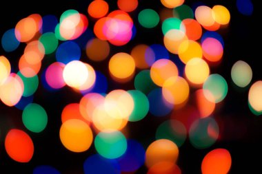 Soyut renkli, odaklanmış dairesel fakül. Bokeh bulanık renk ışığı arka planı kullanabilir. Yeni yıl Bokeh feshi