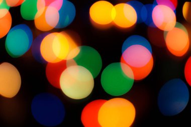 Soyut renkli, odaklanmış dairesel fakül. Bokeh bulanık renk ışığı arka planı kullanabilir. Yeni yıl Bokeh feshi