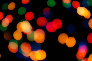 Soyut renkli, odaklanmış dairesel fakül. Bokeh bulanık renk ışığı arka planı kullanabilir. Yeni yıl Bokeh feshi