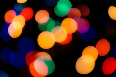 Soyut renkli, odaklanmış dairesel fakül. Bokeh bulanık renk ışığı arka planı kullanabilir. Yeni yıl Bokeh feshi