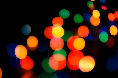 Soyut renkli, odaklanmış dairesel fakül. Bokeh bulanık renk ışığı arka planı kullanabilir. Yeni yıl Bokeh feshi