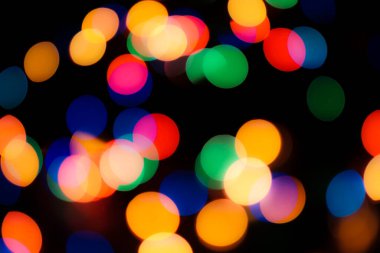 Soyut renkli, odaklanmış dairesel fakül. Bokeh bulanık renk ışığı arka planı kullanabilir. Yeni yıl Bokeh feshi