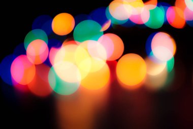 Soyut renkli, odaklanmış dairesel fakül. Bokeh bulanık renk ışığı arka planı kullanabilir. Yeni yıl Bokeh feshi