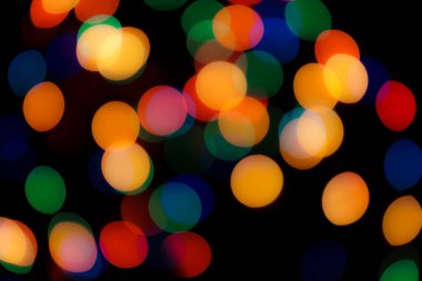 Soyut renkli, odaklanmış dairesel fakül. Bokeh bulanık renk ışığı arka planı kullanabilir. Yeni yıl Bokeh feshi