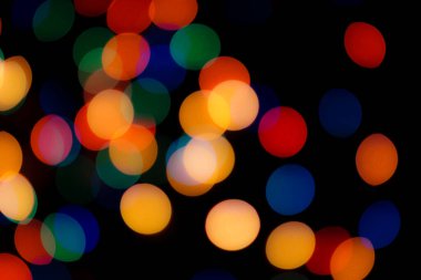 Soyut renkli, odaklanmış dairesel fakül. Bokeh bulanık renk ışığı arka planı kullanabilir. Yeni yıl Bokeh feshi