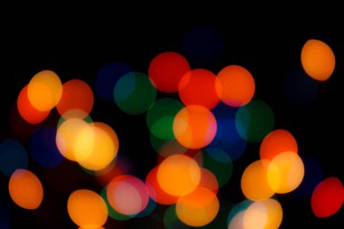 Soyut renkli, odaklanmış dairesel fakül. Bokeh bulanık renk ışığı arka planı kullanabilir. Yeni yıl Bokeh feshi