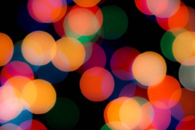 Soyut renkli, odaklanmış dairesel fakül. Bokeh bulanık renk ışığı arka planı kullanabilir. Yeni yıl Bokeh feshi