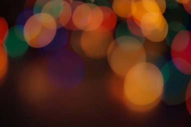 Soyut renkli, odaklanmış dairesel fakül. Bokeh bulanık renk ışığı arka planı kullanabilir. Yeni yıl Bokeh feshi