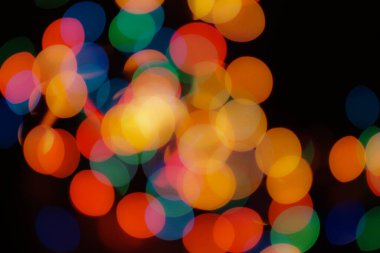 Soyut renkli, odaklanmış dairesel fakül. Bokeh bulanık renk ışığı arka planı kullanabilir. Yeni yıl Bokeh feshi