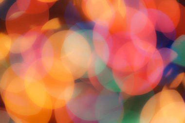 Soyut renkli, odaklanmış dairesel fakül. Bokeh bulanık renk ışığı arka planı kullanabilir. Yeni yıl Bokeh feshi