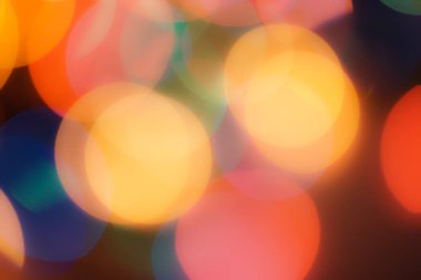 Soyut renkli, odaklanmış dairesel fakül. Bokeh bulanık renk ışığı arka planı kullanabilir. Yeni yıl Bokeh feshi