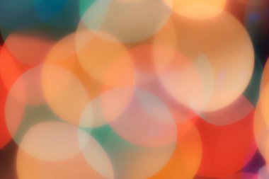 Soyut renkli, odaklanmış dairesel fakül. Bokeh bulanık renk ışığı arka planı kullanabilir. Yeni yıl Bokeh feshi