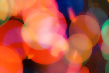 Soyut renkli, odaklanmış dairesel fakül. Bokeh bulanık renk ışığı arka planı kullanabilir. Yeni yıl Bokeh feshi