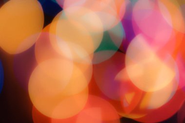 Soyut renkli, odaklanmış dairesel fakül. Bokeh bulanık renk ışığı arka planı kullanabilir. Yeni yıl Bokeh feshi