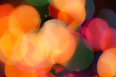 Soyut renkli, odaklanmış dairesel fakül. Bokeh bulanık renk ışığı arka planı kullanabilir. Yeni yıl Bokeh feshi