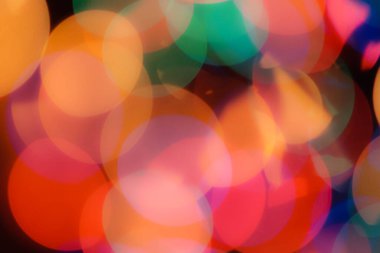 Soyut renkli, odaklanmış dairesel fakül. Bokeh bulanık renk ışığı arka planı kullanabilir. Yeni yıl Bokeh feshi