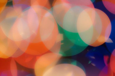 Soyut renkli, odaklanmış dairesel fakül. Bokeh bulanık renk ışığı arka planı kullanabilir. Yeni yıl Bokeh feshi