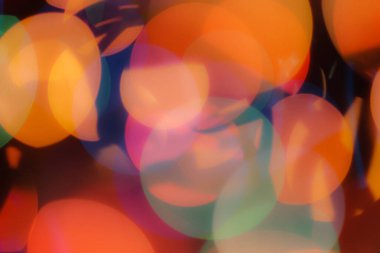 Soyut renkli, odaklanmış dairesel fakül. Bokeh bulanık renk ışığı arka planı kullanabilir. Yeni yıl Bokeh feshi