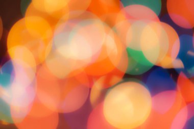 Soyut renkli, odaklanmış dairesel fakül. Bokeh bulanık renk ışığı arka planı kullanabilir. Yeni yıl Bokeh feshi