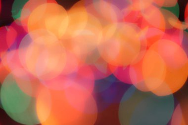 Soyut renkli, odaklanmış dairesel fakül. Bokeh bulanık renk ışığı arka planı kullanabilir. Yeni yıl Bokeh feshi