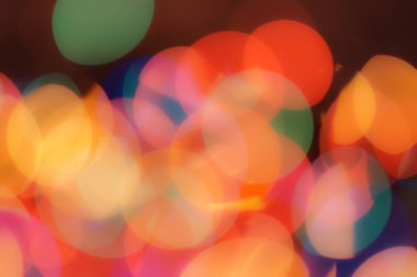 Soyut renkli, odaklanmış dairesel fakül. Bokeh bulanık renk ışığı arka planı kullanabilir. Yeni yıl Bokeh feshi