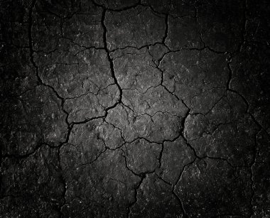 Siyah çatlamış zemin dokusu arka planı