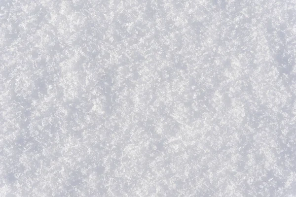 白いきれいな光沢のある雪の背景のテクスチャ 新鮮な雪のテクスチャ 雪の表面のクローズアップ — ストック写真