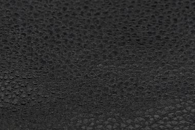 Siyah doğal deri desenli makro. Koyu renkli bir madde, duvar kağıdı arkaplan