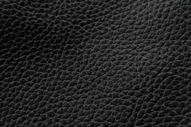 Siyah doğal deri desenli makro. Koyu renkli bir madde, duvar kağıdı arkaplan