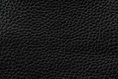 Siyah doğal deri desenli makro. Koyu renkli bir madde, duvar kağıdı arkaplan