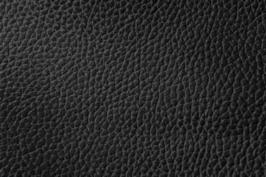 Siyah doğal deri desenli makro. Koyu renkli bir madde, duvar kağıdı arkaplan