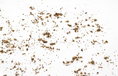 Bread crumbs on a white background. Scattered remnants of bread clipart