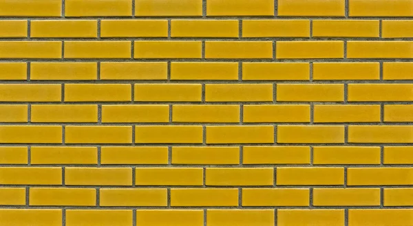 デザイナーのための空白の黄色のレンガの壁の背景のテクスチャ レンガ造りの断片 — ストック写真