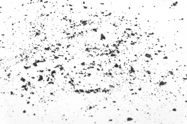 Black ground scattered on a white background, dirt and dust on a white background