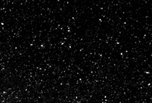 Siyah arkaplanda kaotik beyaz bokeh, ışık lekeleri dokusu, soyut bulanıklık, düşen kar, yıldızlı gökyüzü