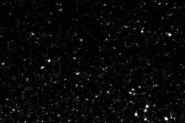 Siyah arkaplanda kaotik beyaz bokeh, ışık lekeleri dokusu, soyut bulanıklık, düşen kar, yıldızlı gökyüzü