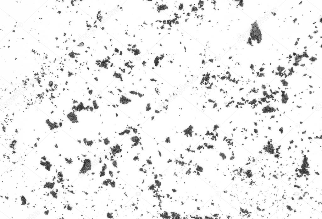 Black ground scattered on a white background, dirt and dust on a white background